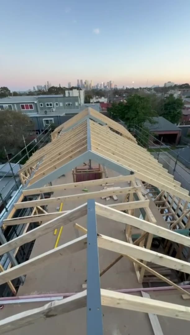 Roof framing with Melbourne skyline beyond